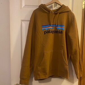 Patagonia Yellow Hoodie with Blue and Orange Stripe Logo. EUC